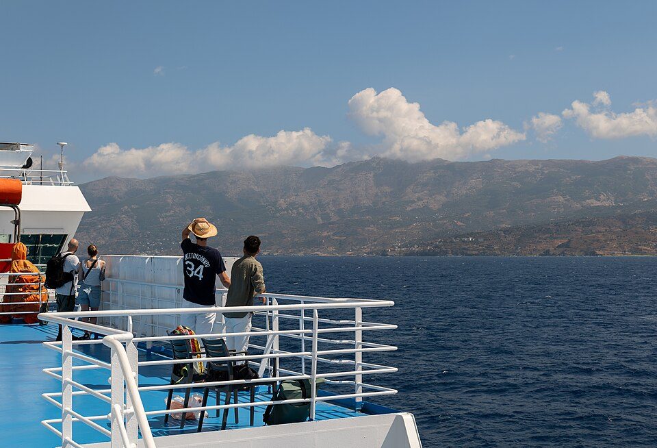 People looking at the Icarian coastline from a ferry, Icarian Sea, Greece julesvernex2