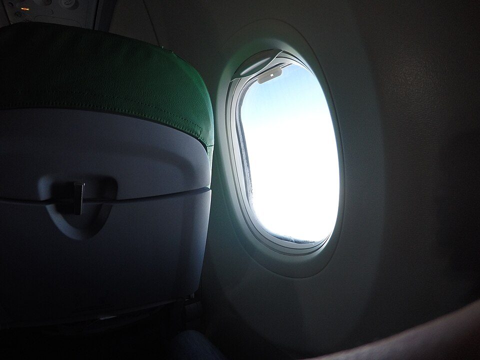 Plane Window (Unsplash)